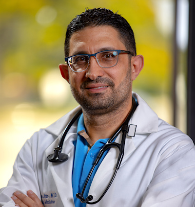 Dr, Ghassan A Atto, MD, Profile image with lab coat and stethoscope 